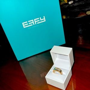 This is a EFFY Mens ring 14 K white and yellow Gold with .20 TW round diamonds